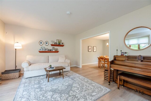 living area with wood finished floors and baseboards