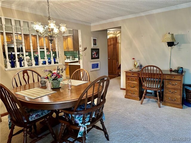 dining space featuring a chandelier, light colored carpet, ornamental molding, and a textured ceiling