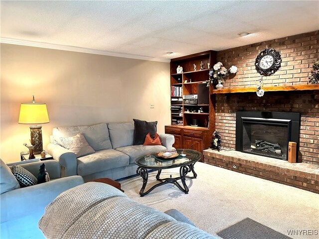 living room featuring ornamental molding, carpet, a fireplace, and a textured ceiling