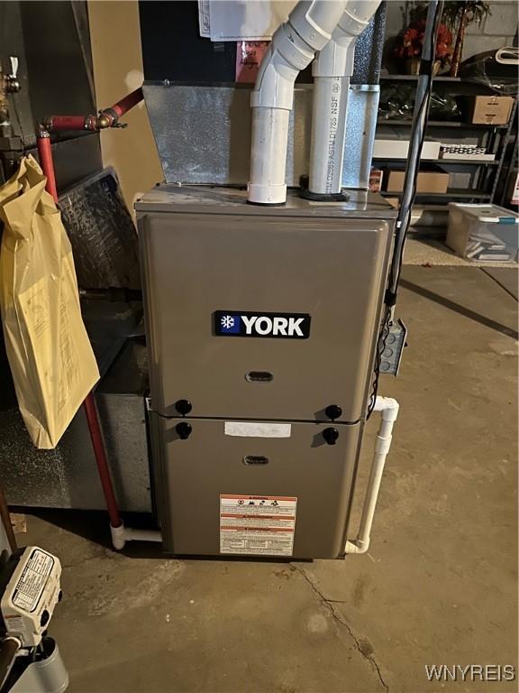 utility room with heating unit