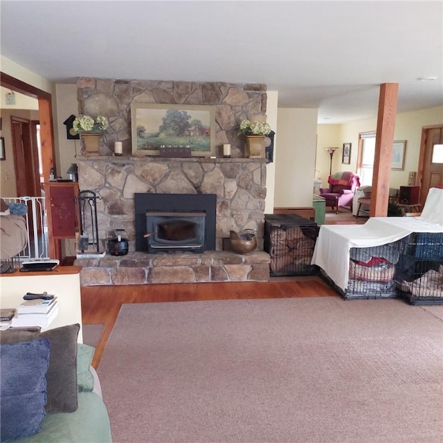 4510 Colvin Hill Rd, Troupsburg, NY 14898 - living area with wood finished floors and a stone fireplace