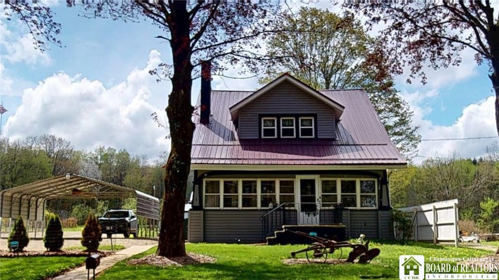 700 Buffalo St, Jamestown, NY 14701 - view of front of house with a carport, a front lawn, and metal roof