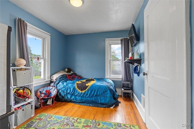 bedroom featuring wood finished floors