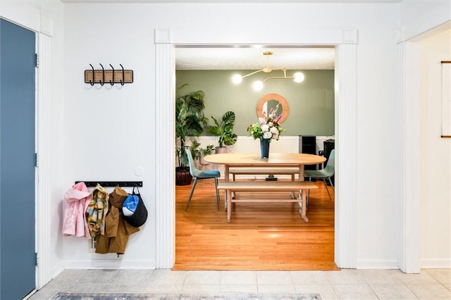 dining room featuring light tile patterned floors and baseboards