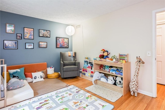 playroom with wood finished floors