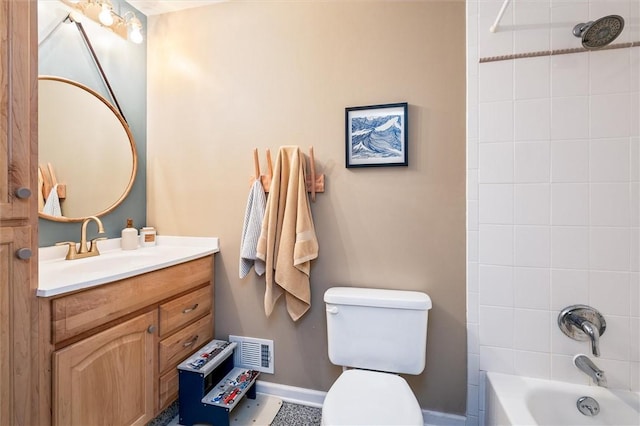 full bath featuring toilet, vanity, washtub / shower combination, and baseboards