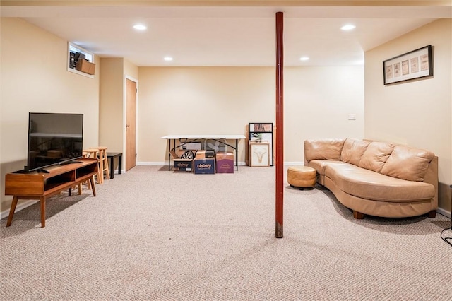 carpeted living area with recessed lighting and baseboards