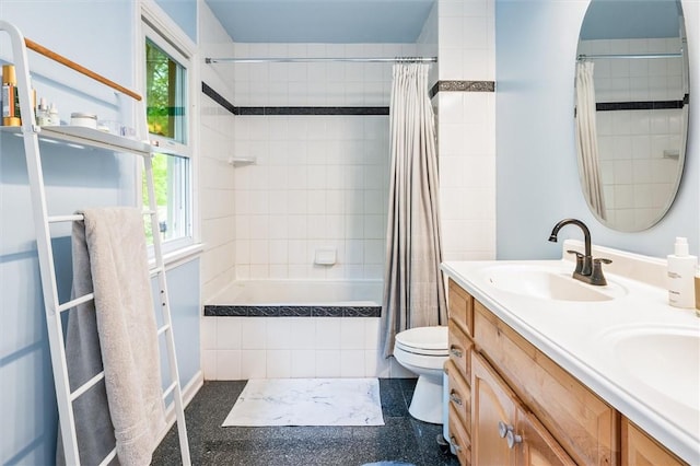 full bath featuring tiled shower / bath combo, plenty of natural light, toilet, and double vanity
