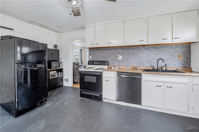kitchen featuring stainless steel appliances, a sink, concrete flooring, and white cabinetry