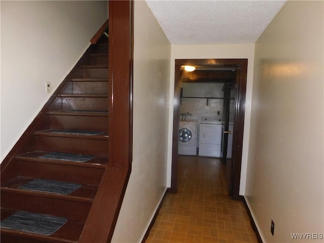 stairs featuring washer and clothes dryer and baseboards