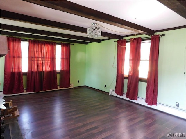 empty room featuring beam ceiling, wood finished floors, baseboards, and a baseboard heating unit