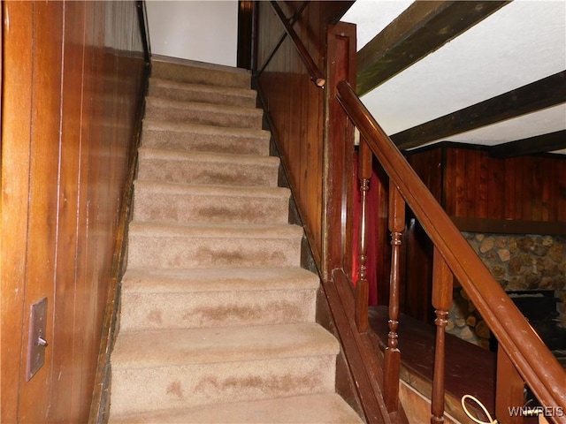 staircase with wooden walls