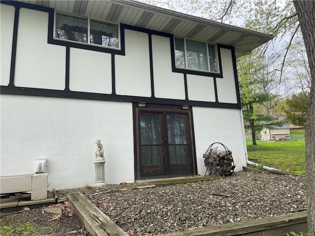 120 Bradley Ct, Horseheads, NY 14845 - view of exterior entry featuring stucco siding and french doors
