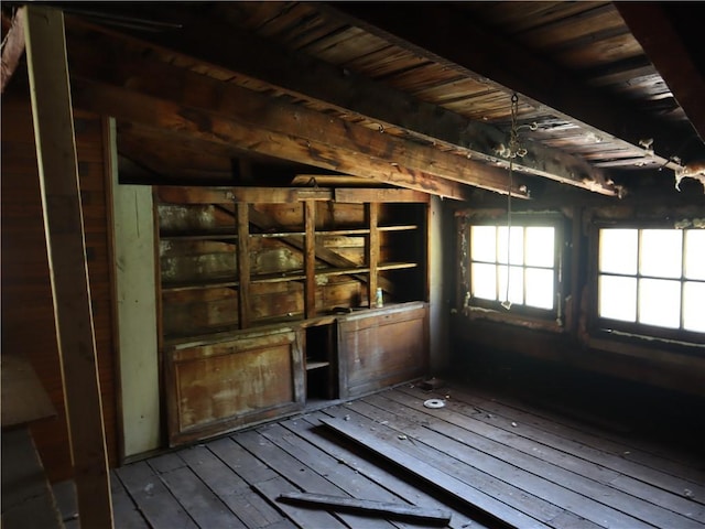 misc room with hardwood / wood-style flooring, wooden ceiling, and beam ceiling