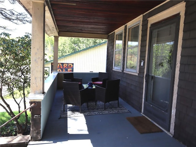 view of patio with a porch and outdoor lounge area