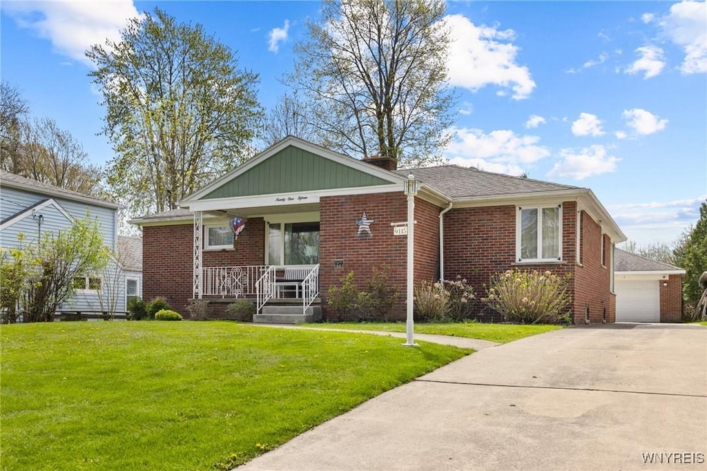 9115 Griffon Ave, Niagara Falls, NY 14304 - view of front of property with covered porch, brick siding, and a front yard