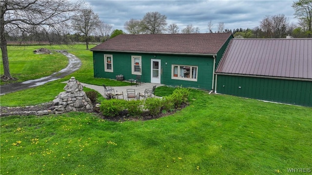 back of house with a yard