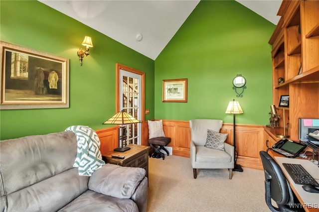 carpeted home office with vaulted ceiling