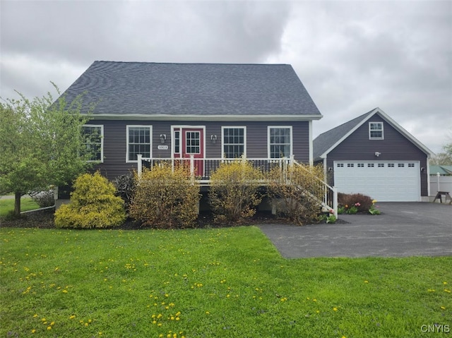1003 Waterview Dr, Vienna, NY 13308 - cape cod house with a front yard, a detached garage, and roof with shingles