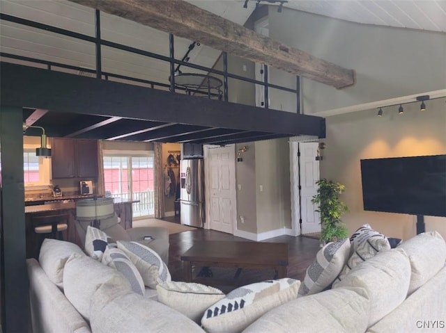 1003 Waterview Dr, Vienna, NY 13308 - living area featuring a towering ceiling, baseboards, and wood finished floors