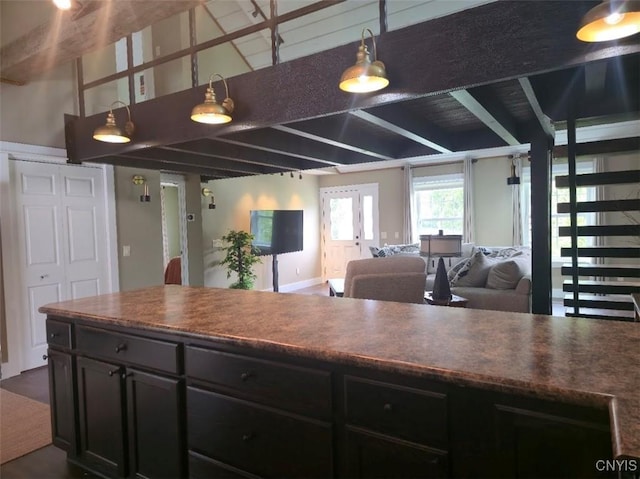 1003 Waterview Dr, Vienna, NY 13308 - kitchen with open floor plan, beamed ceiling, dark countertops, and pendant lighting
