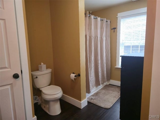1003 Waterview Dr, Vienna, NY 13308 - full bath featuring toilet, wood finished floors, a shower with shower curtain, and baseboards