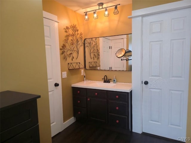 1003 Waterview Dr, Vienna, NY 13308 - bathroom with vanity, wood finished floors, and baseboards