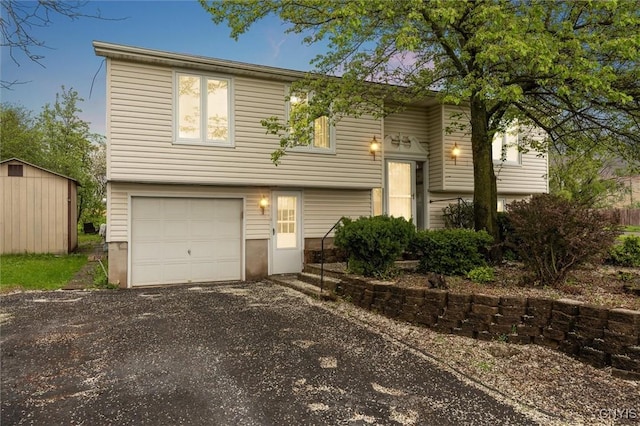7700 Fitzpatrick Dr, Clay, NY 13088 - split foyer home with an attached garage and gravel driveway