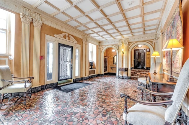 lobby with coffered ceiling and crown molding