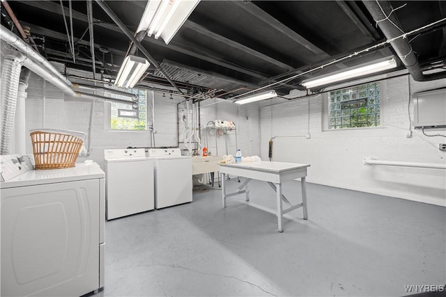 washroom with washer and clothes dryer and plenty of natural light