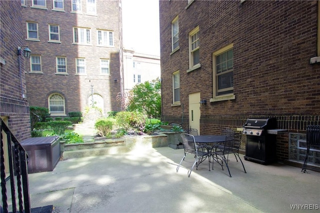view of patio featuring grilling area and outdoor dining space