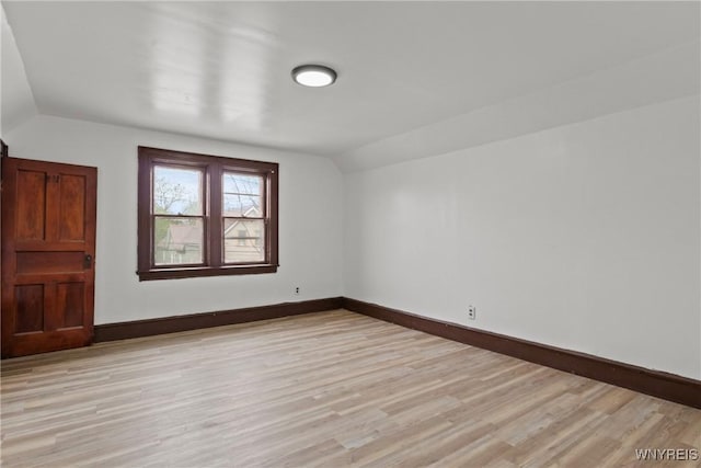 75 Box Ave, Buffalo, NY 14211 - unfurnished room featuring vaulted ceiling, baseboards, and light wood finished floors