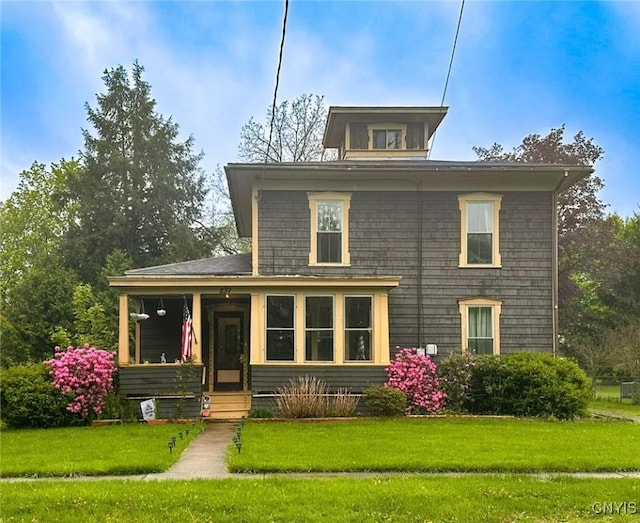 237 James St, Lenox, NY 13032 - american foursquare style home featuring a front lawn and covered porch