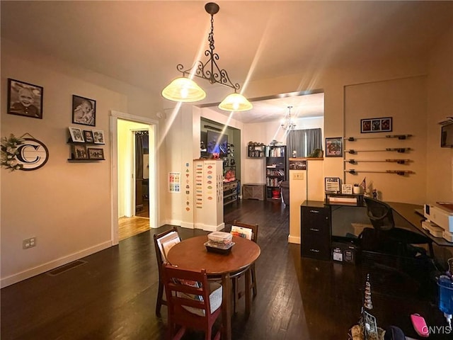 237 James St, Lenox, NY 13032 - dining area featuring dark wood-type flooring, a chandelier, baseboards, and a desk