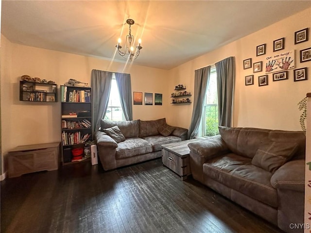 237 James St, Lenox, NY 13032 - living room featuring dark wood finished floors and a chandelier