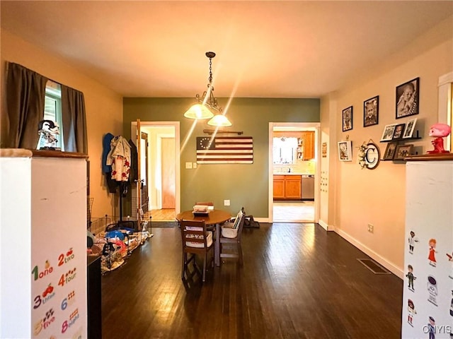 237 James St, Lenox, NY 13032 - dining space featuring dark wood finished floors and baseboards