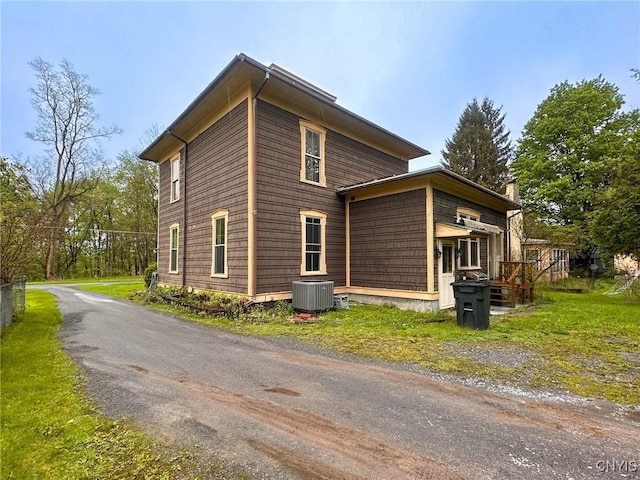 237 James St, Lenox, NY 13032 - view of property exterior featuring central AC and a chimney