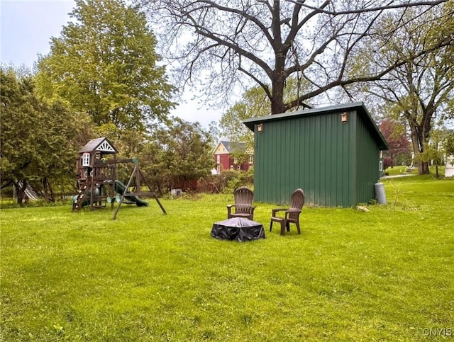 237 James St, Lenox, NY 13032 - view of grassy yard featuring a playground and an outbuilding