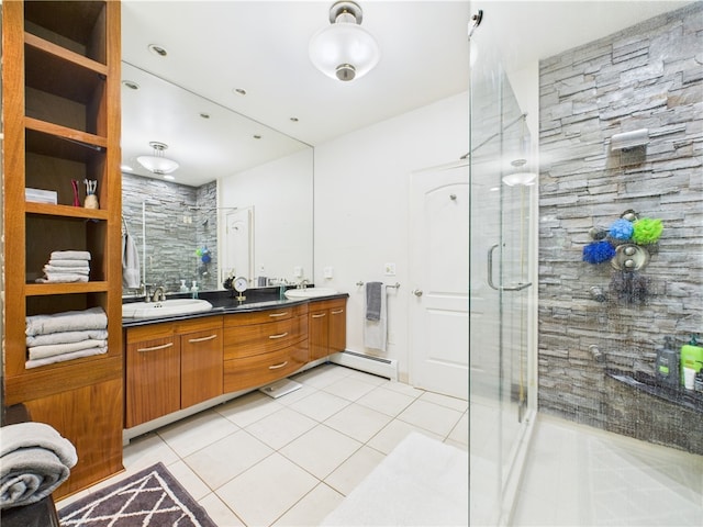 bathroom with a baseboard radiator, tile patterned flooring, a stall shower, and double vanity