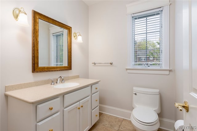 56 Sunset Ln, Orchard Park, NY 14127 - bathroom featuring baseboards, toilet, tile patterned flooring, and vanity