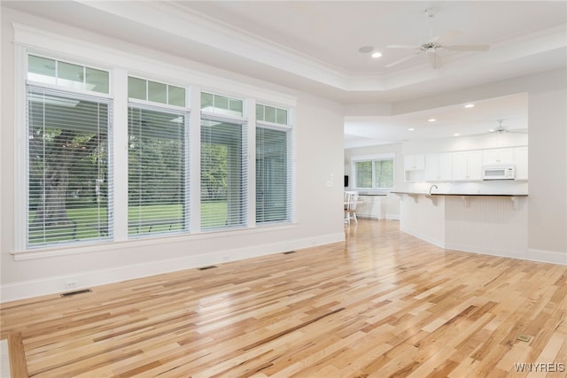 56 Sunset Ln, Orchard Park, NY 14127 - unfurnished living room featuring light wood-style floors, ceiling fan, recessed lighting, ornamental molding, and baseboards