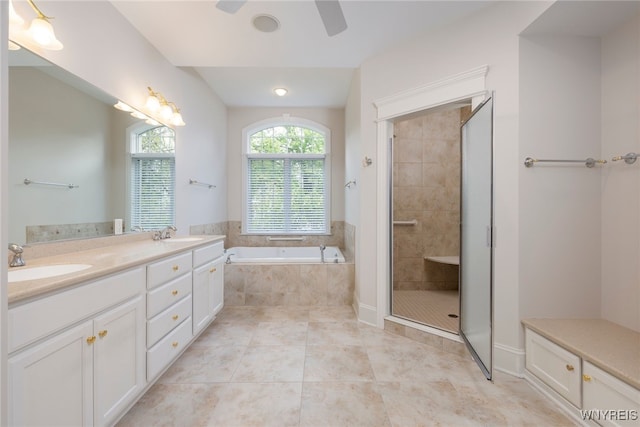 56 Sunset Ln, Orchard Park, NY 14127 - full bath featuring a ceiling fan, a bath, tiled shower, tile patterned flooring, and double vanity