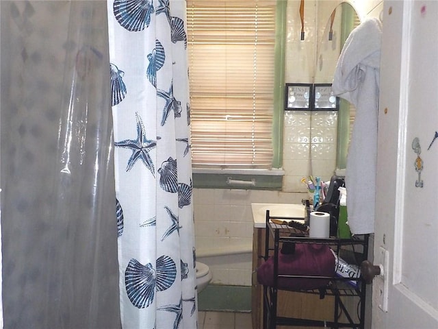 full bathroom featuring tile walls, vanity, toilet, and tile patterned flooring