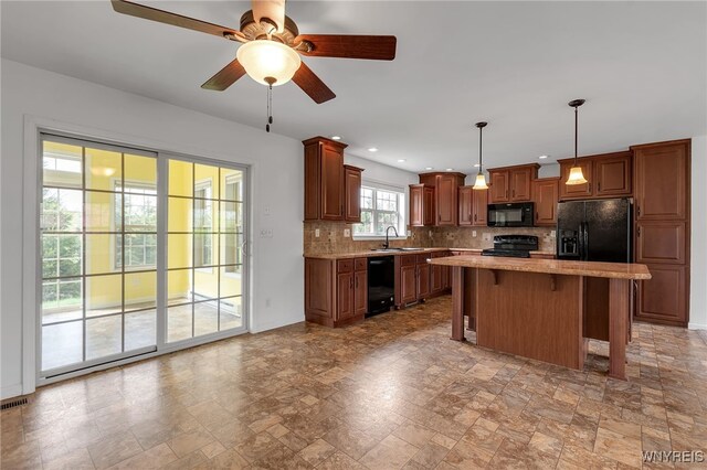 1275 Center St, Aurora, NY 14052 - kitchen with black appliances, a sink, light stone finish flooring, backsplash, and a ceiling fan