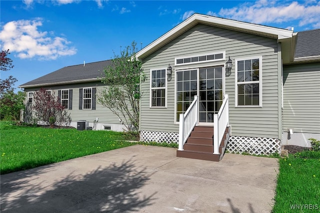 1275 Center St, Aurora, NY 14052 - back of house featuring a patio area, a yard, entry steps, and central AC