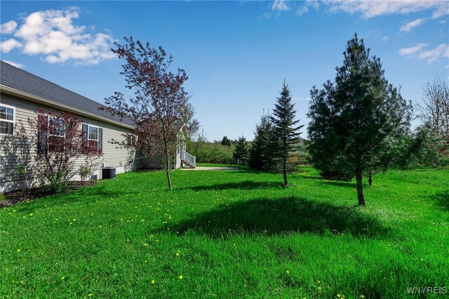 1275 Center St, Aurora, NY 14052 - view of green lawn with central AC