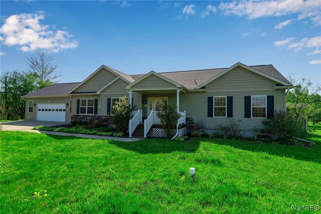 1275 Center St, Aurora, NY 14052 - view of front facade with a garage, concrete driveway, and a front lawn