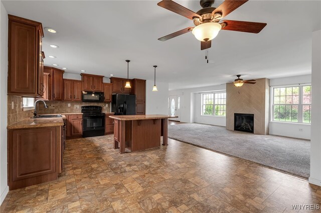 1275 Center St, Aurora, NY 14052 - kitchen featuring black appliances, a sink, ceiling fan, plenty of natural light, and recessed lighting