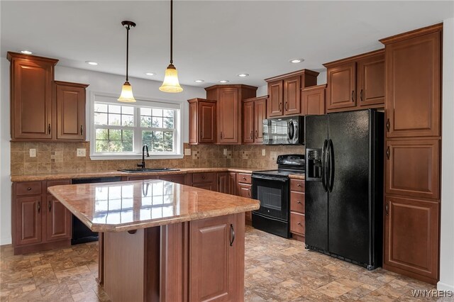 1275 Center St, Aurora, NY 14052 - kitchen with black appliances, a sink, a kitchen island, stone finish floors, and recessed lighting