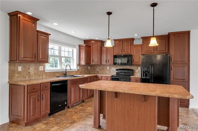1275 Center St, Aurora, NY 14052 - kitchen with black appliances, a sink, a center island, decorative light fixtures, and stone finish floors